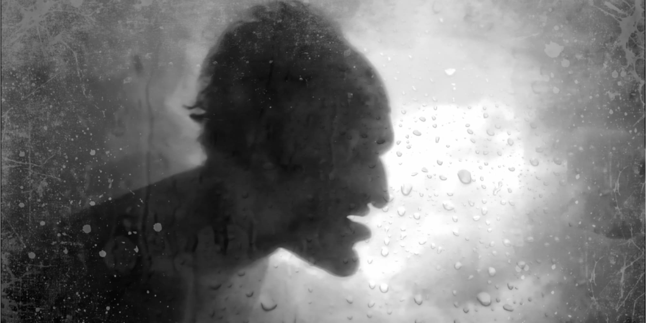 Rondo Hatton's silhouette against a rainy window.