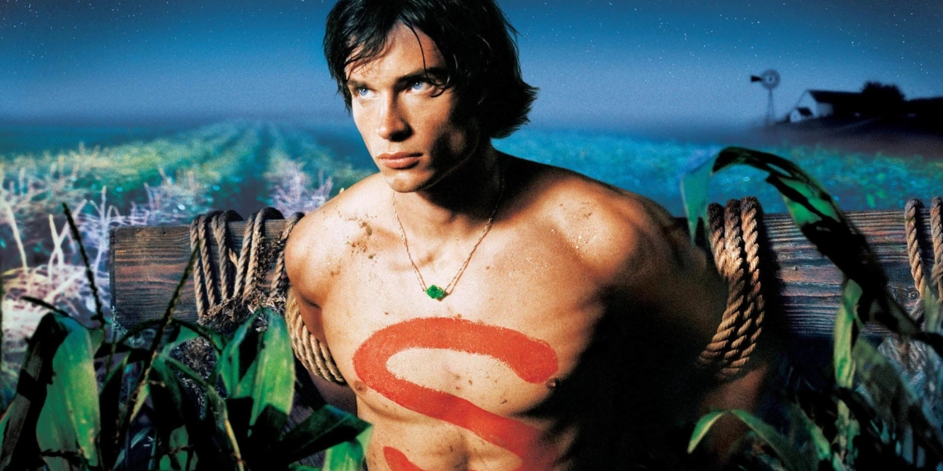 SMALLVILLE: Tom Welling as Clark Kent. Clark is tied to a post in a field with an "S" painted on his chest.